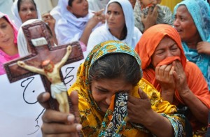 Pakistani Christians protest against the suicide bombing in All Saints church in the northwestern city of Peshawar on September 23, 2013. The death toll from a double suicide bombing on a church in Pakistan rose to 81, as Christians protested across the country to demand better protection for their community. AFP PHOTO/ A MAJEED (Photo credit should read A Majeed/AFP/Getty Images)